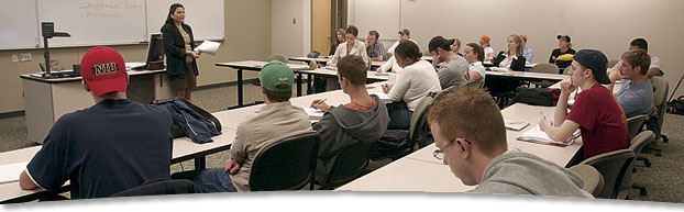 Photo of professor speaking in front of class